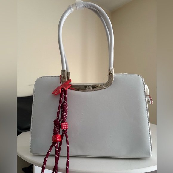 Unbranded Handbags - NWT Elegant White Handbag with Red bow bag charm
